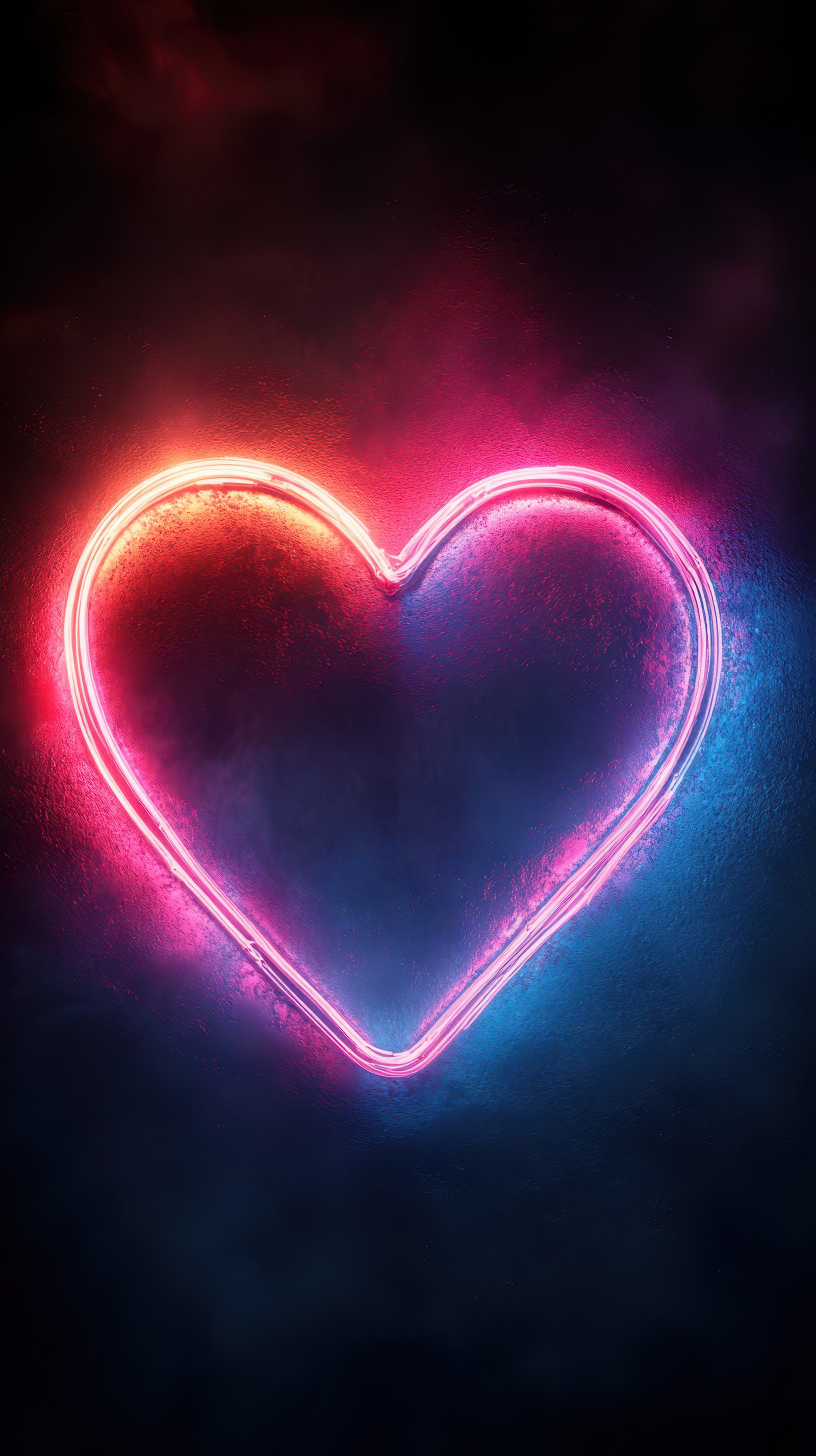 Colorful heart-shaped neon light glowing against a dark background creating a vibrant atmosphere for events or decor
